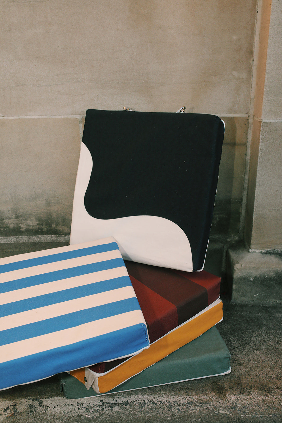 A stack of Mylle Hot Seats, the premier portable heated cushions.
